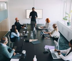 services-man-presenting-in-conference-room