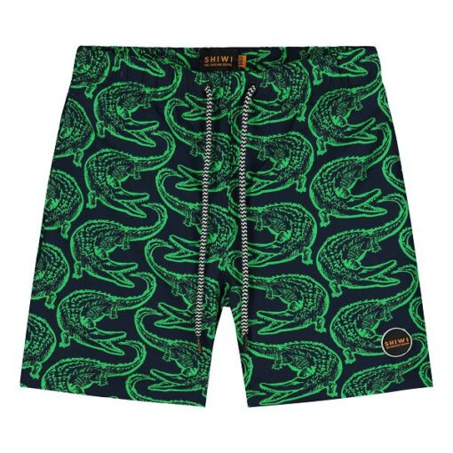 voorzijde van een jongens zwembroek met groene krokodillen print erop